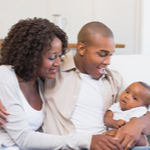 couple holding their baby